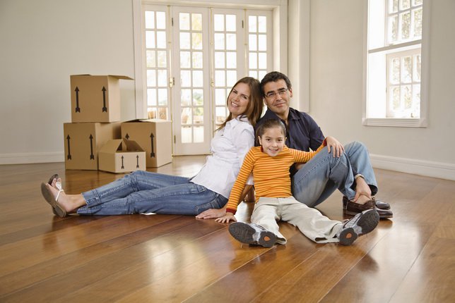 Family posing in new home